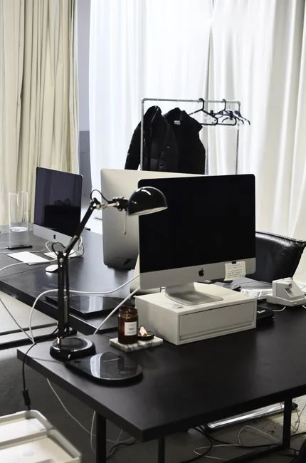 A focused designer works on a user-centric project in a modern office environment.